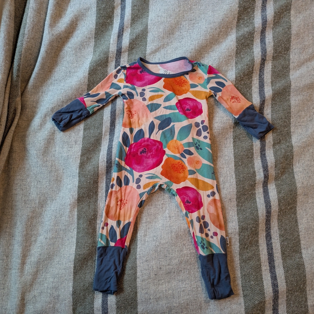 Pink and Orange Footies One Piece with Vibrant Floral Patterns